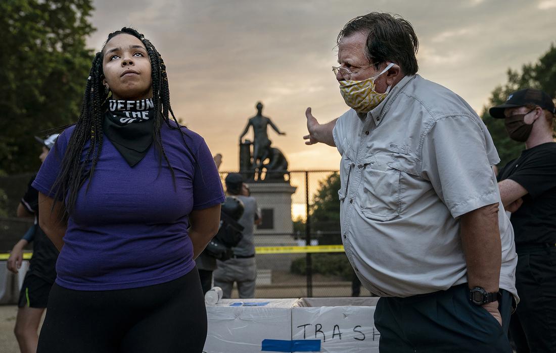 Anais, 26, who wants to remove the Emancipation statue in Lincoln Park in Washington, DC, argues with a man who argues to keep it, June 25th, 2020. Critics say the Emancipation Memorial — which shows Lincoln holding a copy of the Emancipation Proclam