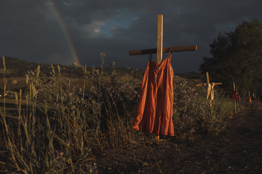 A red dress along the highway signifies the children who died at the Kamloops Indian Residential School in Kamloops, British Columbia on Saturday, June 19, 2021. Red dresses are also used to signify the disproportionate number of missing and murdered