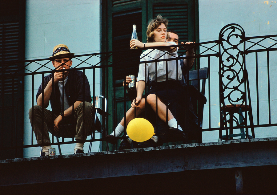Three friends look down from a balcony in New Orleans, 1960. (Photo by Ernst Haas/Hulton Archive/Getty Images)